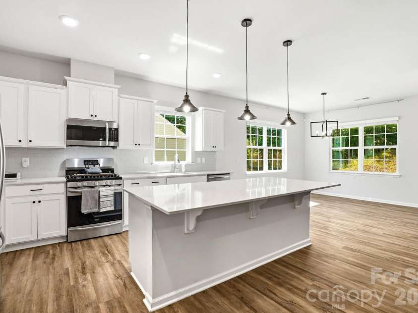 124 Goodleigh Lane, Mooresville, NC 28115.  MLS# CAR4353513, YatesRealty ID 36579. Spacious Kitchen Island Designed for Entertaining