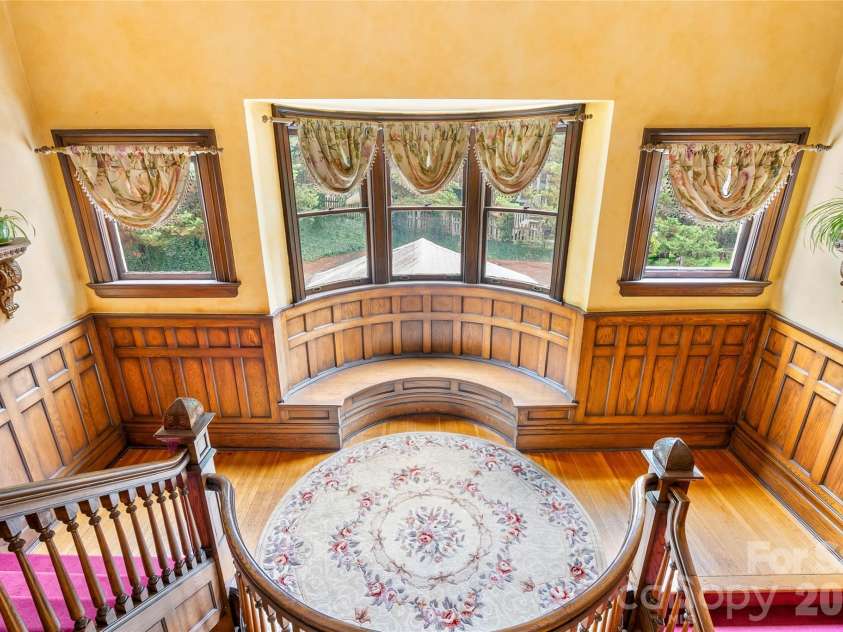 86 Edgemont Road, Asheville, NC 28801.  MLS# CAR4375523, YatesRealty ID 36581. Stunning curved woodwork to second level