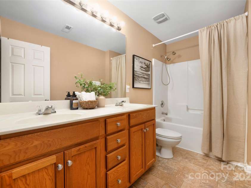 128 Lacona Trace, Mooresville, NC 28115.  MLS# CAR4222843, YatesRealty ID 3660. Upstairs guest bathroom