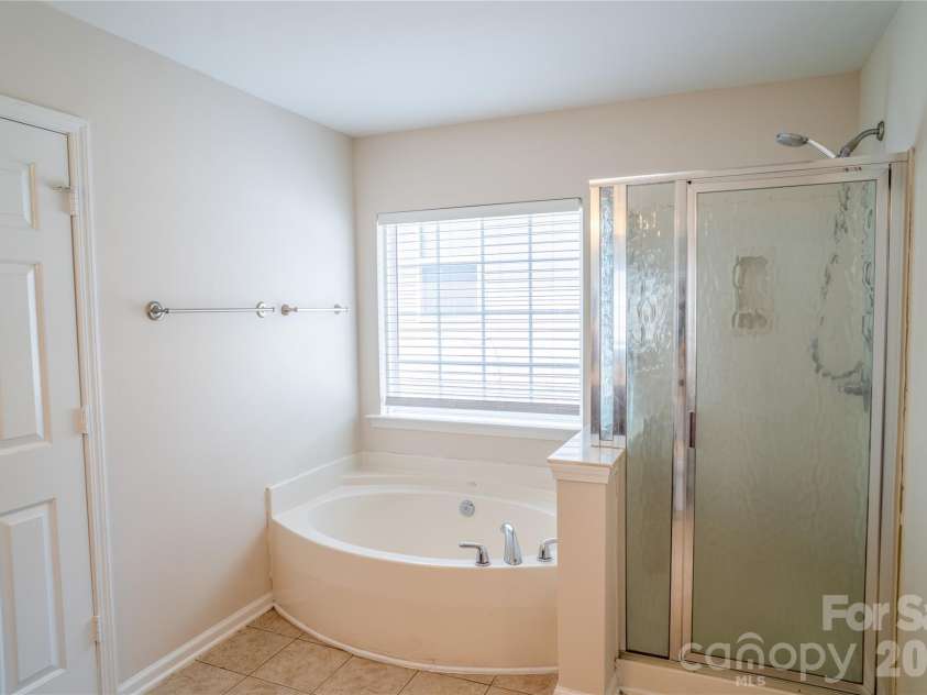 9411 Seamill Road, Charlotte, NC 28278.  MLS# CAR4399402, YatesRealty ID 36609. Master Bathroom Upstairs