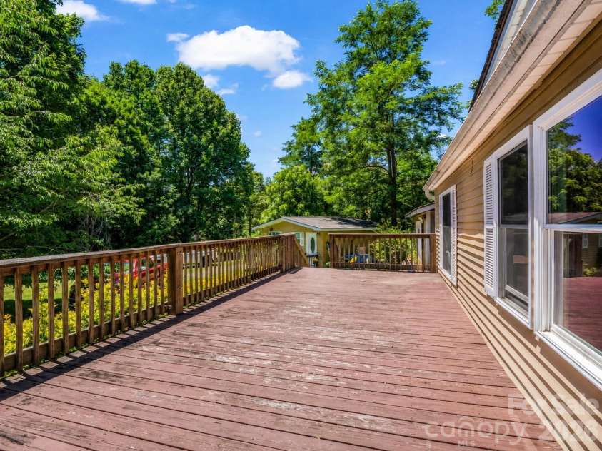 11 Charlie Hill Memorial Drive, Fairview, NC 28730.  MLS# CAR4398558, YatesRealty ID 36610. Looking towards tiny home