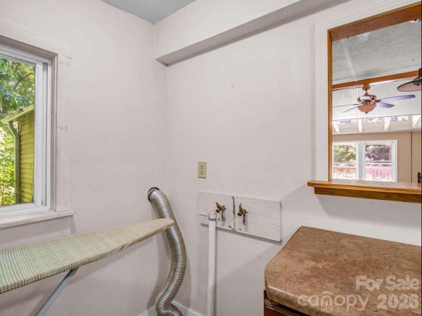 11 Charlie Hill Memorial Drive, Fairview, NC 28730.  MLS# CAR4398558, YatesRealty ID 36610. Main home laundry hookup