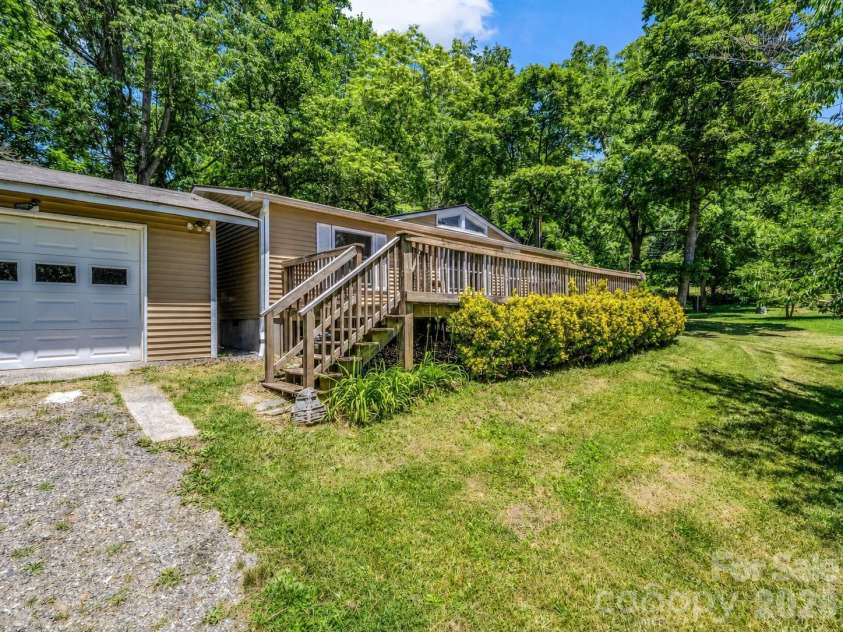 11 Charlie Hill Memorial Drive, Fairview, NC 28730.  MLS# CAR4398558, YatesRealty ID 36610. Main home/garage