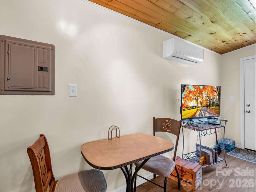 11 Charlie Hill Memorial Drive, Fairview, NC 28730.  MLS# CAR4398558, YatesRealty ID 36610. Tiny home dining