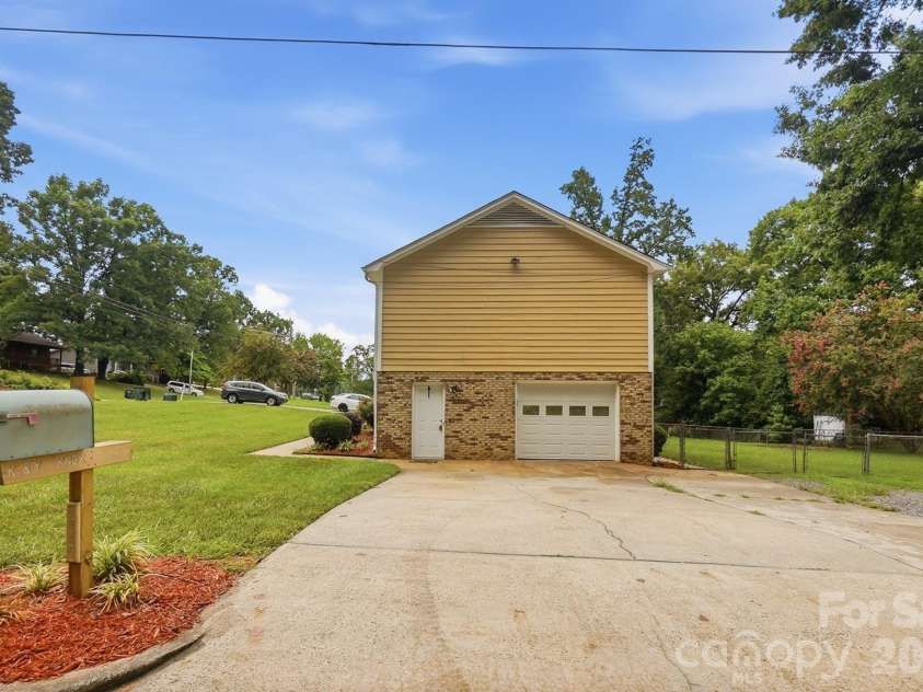 2600 Providence Drive, Gastonia, NC 28052.  MLS# CAR4381747, YatesRealty ID 36615. Long side-load garage allows for ample parking