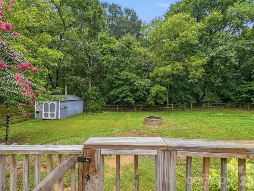 6081 Cambridge Drive, Harrisburg, NC 28075.  MLS# CAR4410918, YatesRealty ID 36625. Back yard