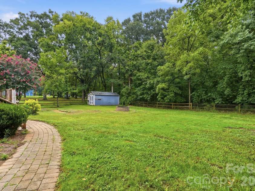 6081 Cambridge Drive, Harrisburg, NC 28075.  MLS# CAR4410918, YatesRealty ID 36625. Back yard