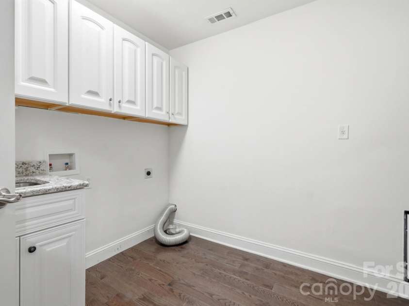 6081 Cambridge Drive, Harrisburg, NC 28075.  MLS# CAR4410918, YatesRealty ID 36625. Laundry room