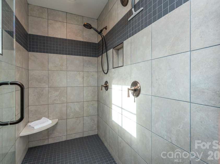 39 Tudor Way, Black Mountain, NC 28711.  MLS# CAR4389836, YatesRealty ID 36643. Dual Headed Shower Primary Bath