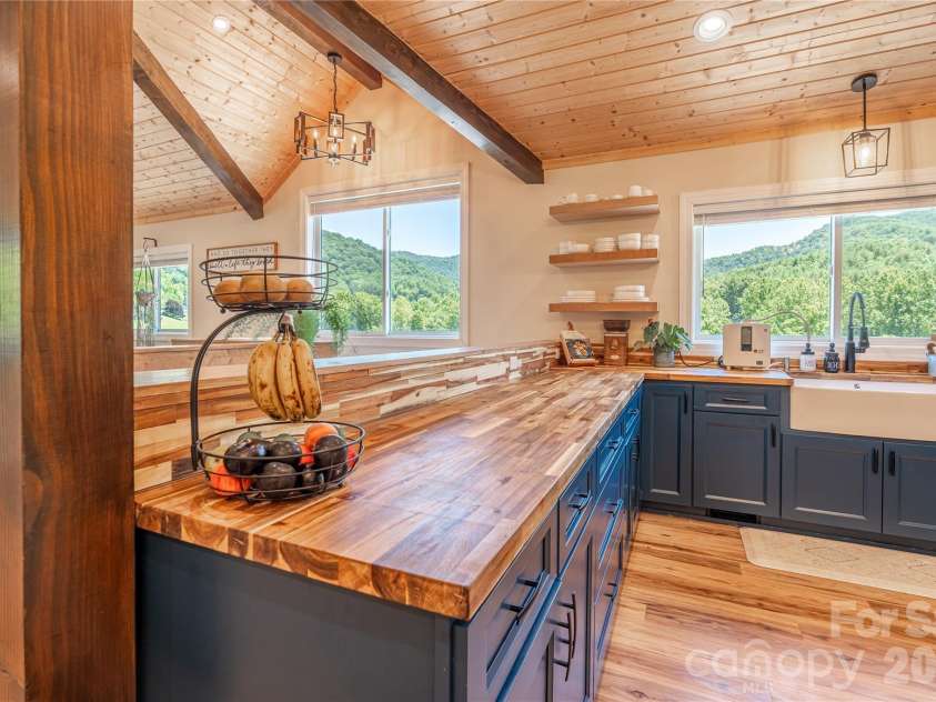 793 State Highway 197 South, Burnsville, NC 28714.  MLS# CAR4401366, YatesRealty ID 36660. Mountain Views from Large Kitchen Windows