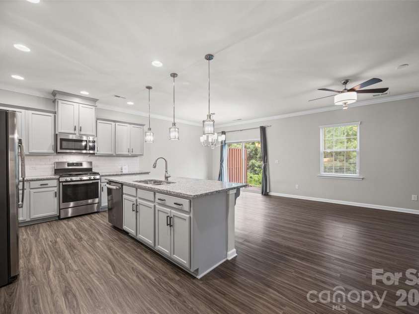 623 Amber Meadows Way, Fort Mill, SC 29708.  MLS# CAR4402607, YatesRealty ID 36714. Kitchen with Large Granite Island