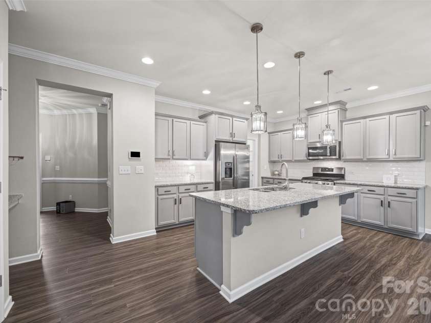 623 Amber Meadows Way, Fort Mill, SC 29708.  MLS# CAR4402607, YatesRealty ID 36714. Kitchen with Large Granite Island