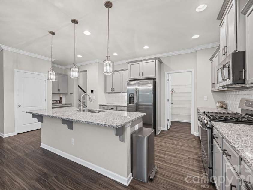 623 Amber Meadows Way, Fort Mill, SC 29708.  MLS# CAR4402607, YatesRealty ID 36714. Kitchen with Large Granite Island