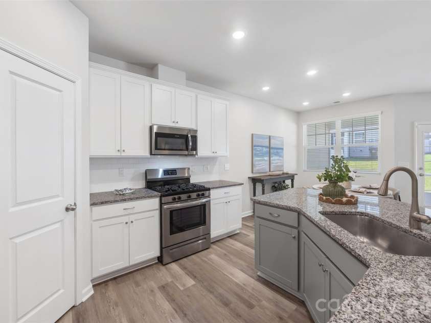 711 Still Oak Trail, Fort Mill, SC 29708.  MLS# CAR4385661, YatesRealty ID 36715. Open kitchen with seamless flow to the main living areas