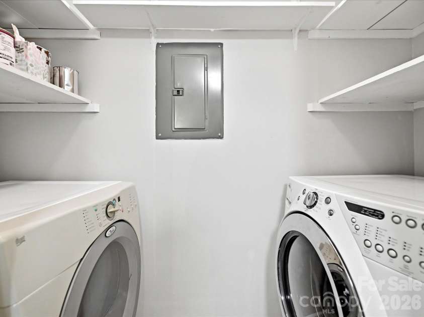 18817 Nautical Drive, Cornelius, NC 28031.  MLS# CAR4402738, YatesRealty ID 36724. A dedicated laundry room with built-in shelving provides added storage and everyday convenience.