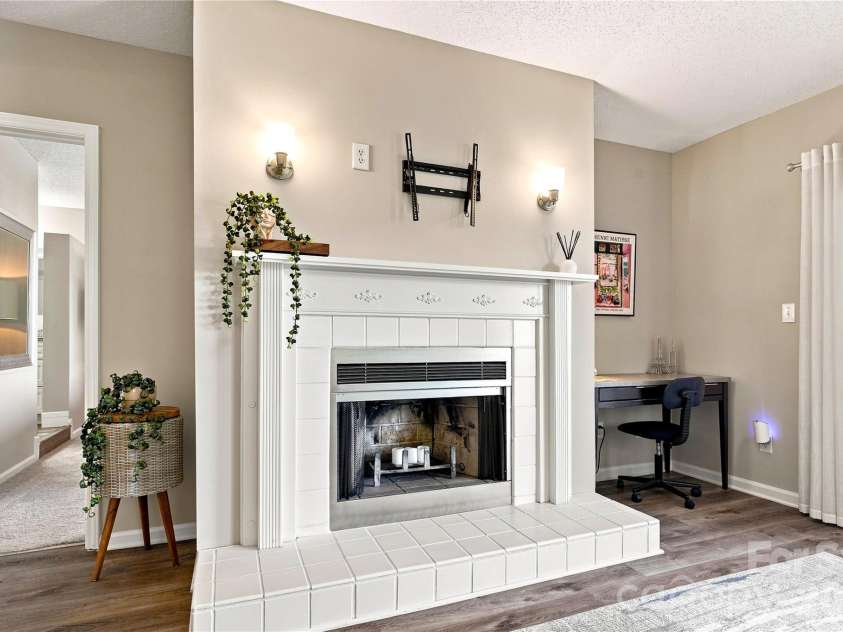 9031 J M Keynes Drive, Charlotte, NC 28262.  MLS# CAR4406099, YatesRealty ID 36738. Cozy fireplace