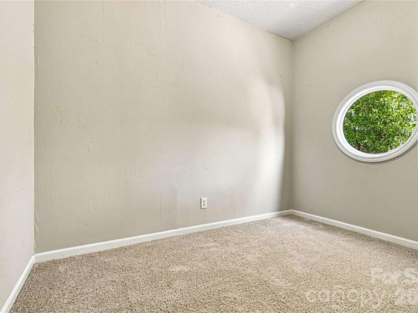 9031 J M Keynes Drive, Charlotte, NC 28262.  MLS# CAR4406099, YatesRealty ID 36738. Storage space with window