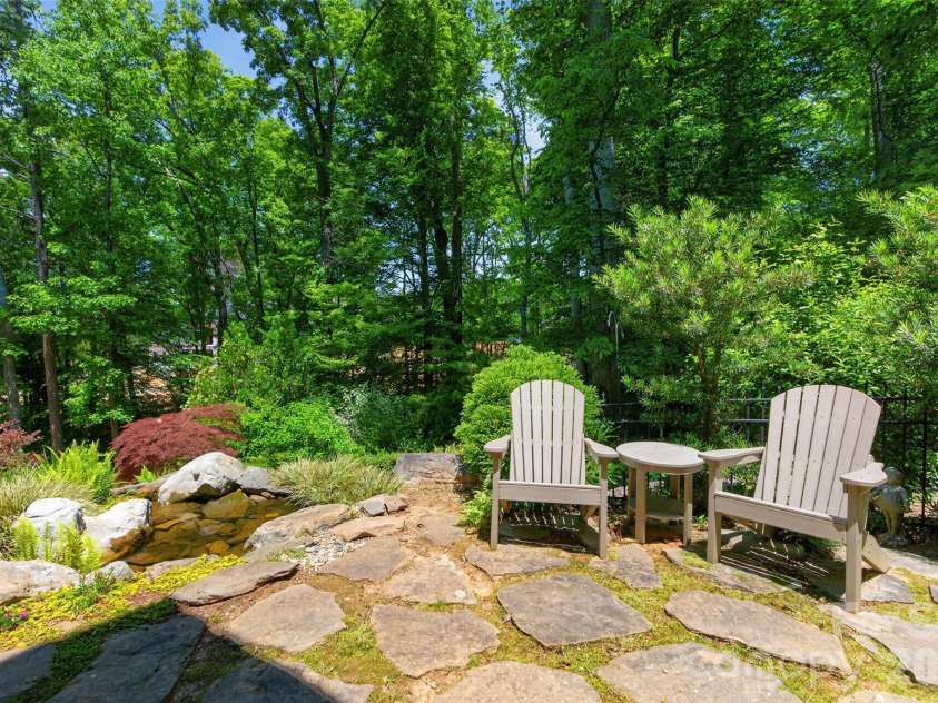 5138 Watermead Lane, Belmont, NC 28012.  MLS# CAR4382710, YatesRealty ID 36739. Lower Stone Patio with Water Fall Feature