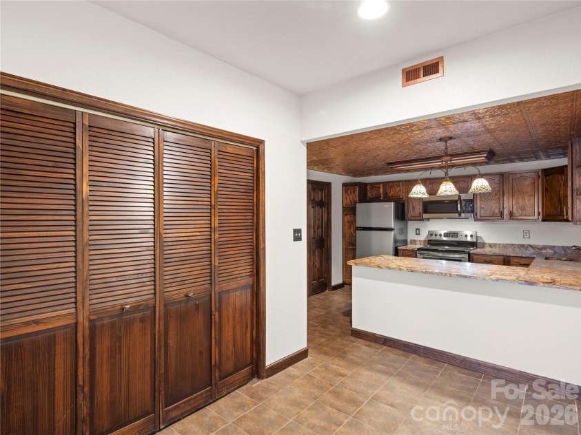 105 Braeside Circle, Asheville, NC 28803.  MLS# CAR4383221, YatesRealty ID 36740. Notice the tile floor and copper ceiling