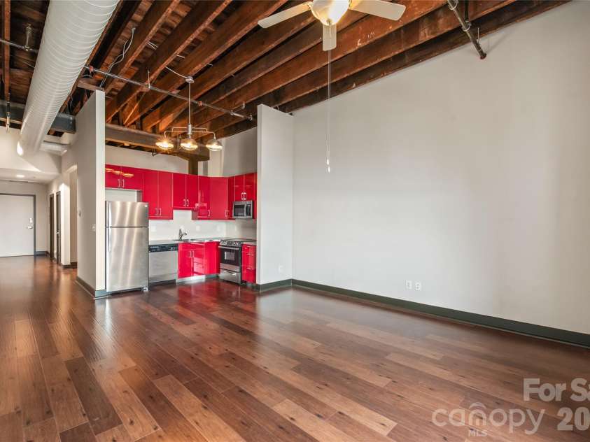 100 Main Avenue, Gastonia, NC 28052.  MLS# CAR4377810, YatesRealty ID 36751. Spacious living room with exposed beams