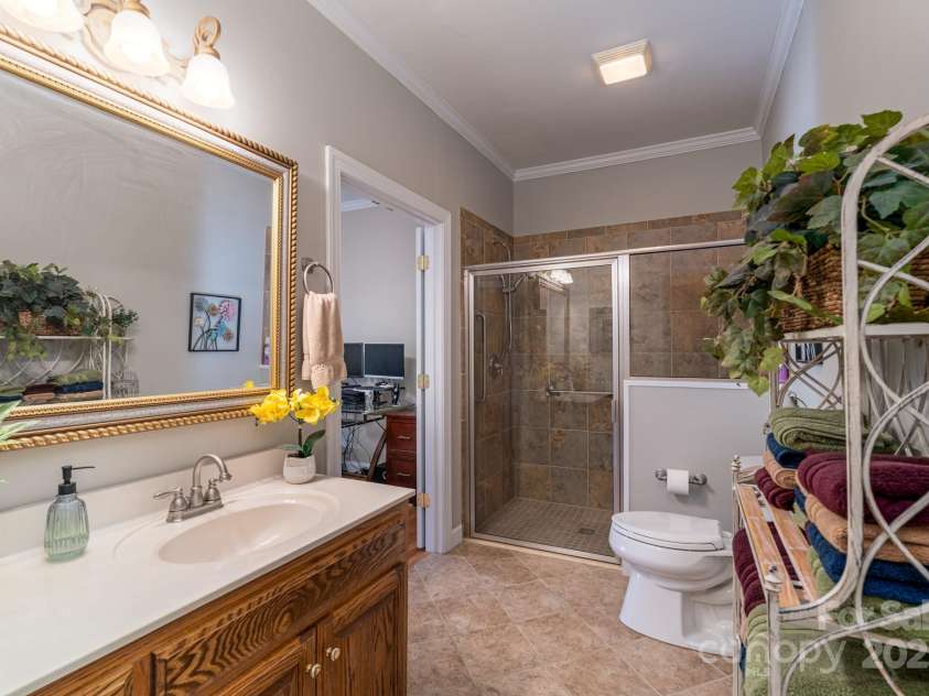 204 Vanderbilt Drive, York, SC 29745.  MLS# CAR4329588, YatesRealty ID 3676. Full Bath down - single vanity, beautiful mirror, ceramic tile - glassed wheelchair accessible shower with grab bars 