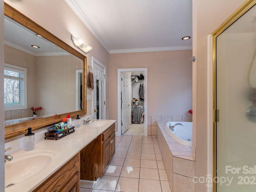 204 Vanderbilt Drive, York, SC 29745.  MLS# CAR4329588, YatesRealty ID 3676. Primary bathroom with double vanities, ceramic tile and separate shower 