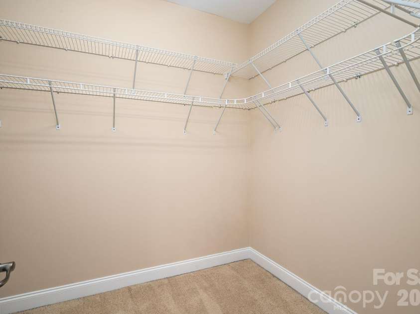 4017 Foxes Trail, Cramerton, NC 28032.  MLS# CAR4392381, YatesRealty ID 36768. Large walk in Primary bedroom closet.