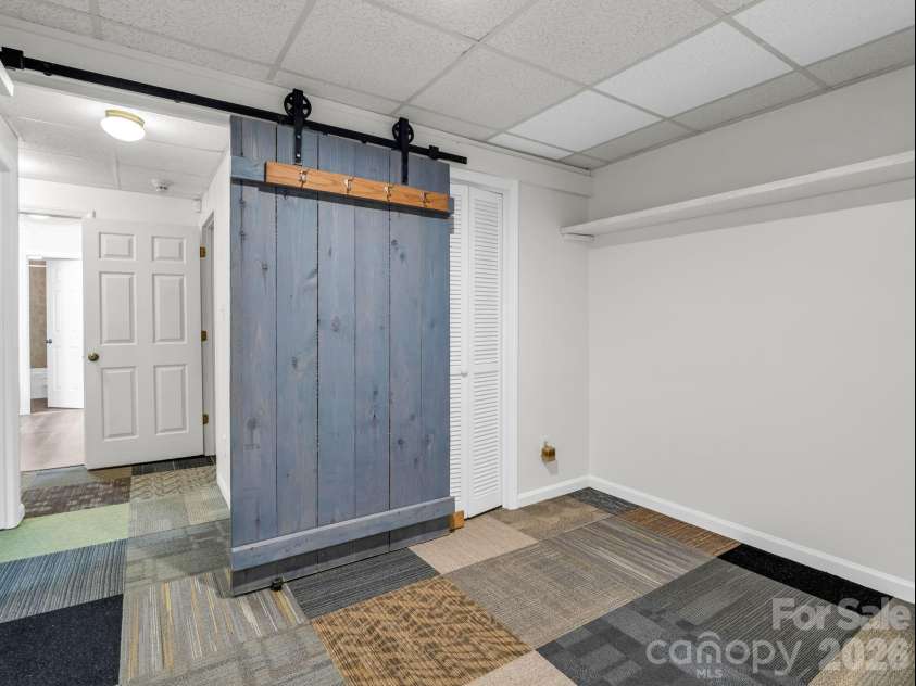 1810 Arbor Way Drive, Shelby, NC 28150.  MLS# CAR4392549, YatesRealty ID 36778. Small bonus room between hall and basement workshop and garage