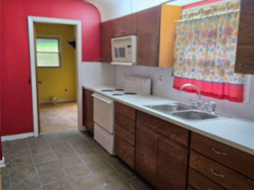 813 Robinson Clemmer Road, Dallas, NC 28034.  MLS# CAR4400860, YatesRealty ID 36784. Guest cottage kitchen view from dining room
