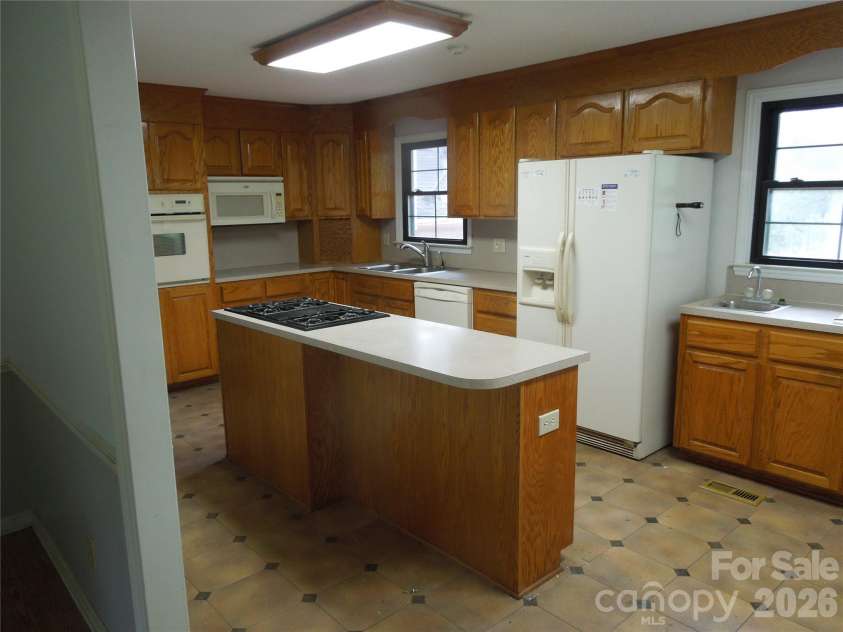 813 Robinson Clemmer Road, Dallas, NC 28034.  MLS# CAR4400860, YatesRealty ID 36784. Main home kitchen view from dining room