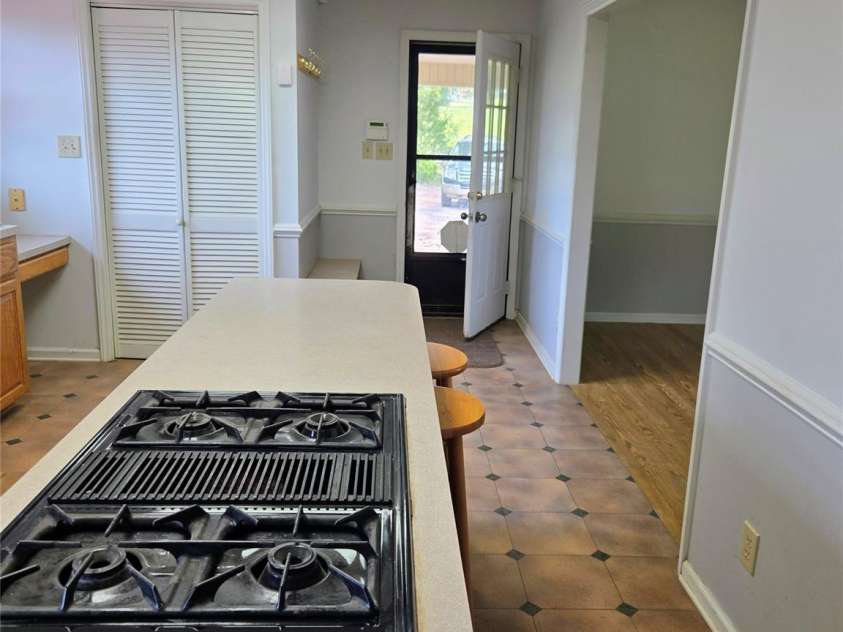813 Robinson Clemmer Road, Dallas, NC 28034.  MLS# CAR4400860, YatesRealty ID 36784. Main home kitchen view from hallway