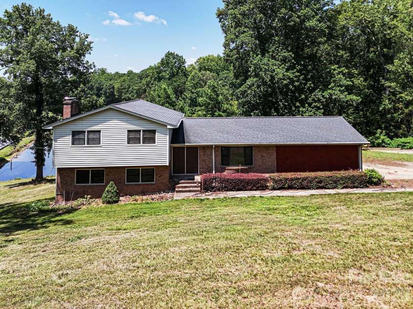813 Robinson Clemmer Road, Dallas, NC 28034.  MLS# CAR4400860, YatesRealty ID 36784. Main home with pond
