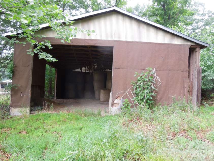 813 Robinson Clemmer Road, Dallas, NC 28034.  MLS# CAR4400860, YatesRealty ID 36784. Side view of hay barn storage