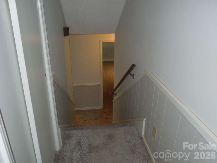 813 Robinson Clemmer Road, Dallas, NC 28034.  MLS# CAR4400860, YatesRealty ID 36784. View from upper to main level stairway