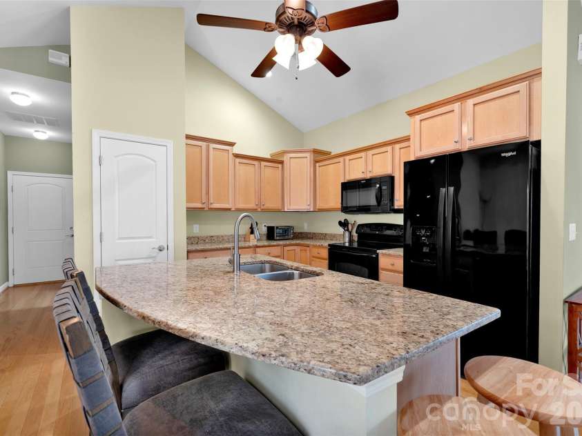 4767 Polo Gate Boulevard, Charlotte, NC 28216.  MLS# CAR4354424, YatesRealty ID 3680. Gourmet kitchen with center island