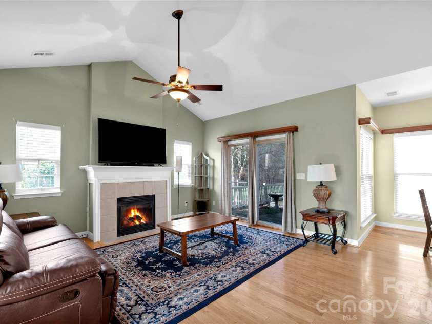 4767 Polo Gate Boulevard, Charlotte, NC 28216.  MLS# CAR4430343, YatesRealty ID 3680. Open floor plan - living room with fireplace