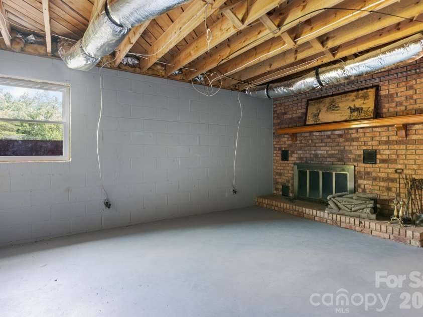 4080 Lanes Road, Vale, NC 28168.  MLS# CAR4388858, YatesRealty ID 36811. Basement Fireplace