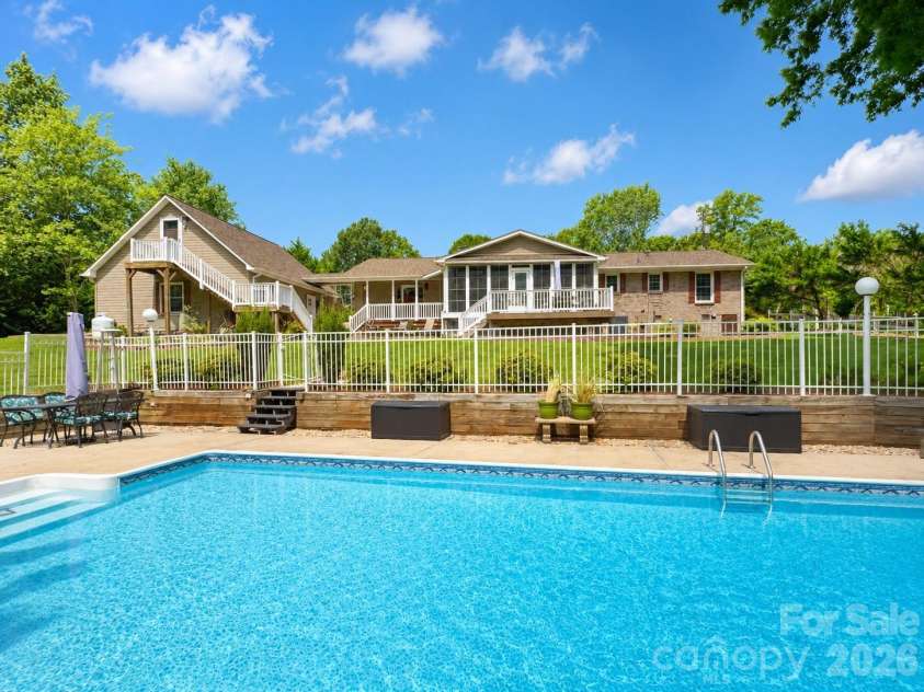 107 Mistywood Drive, Mount Holly, NC 28120.  MLS# CAR4400826, YatesRealty ID 36827. Beautiful pool with big yard