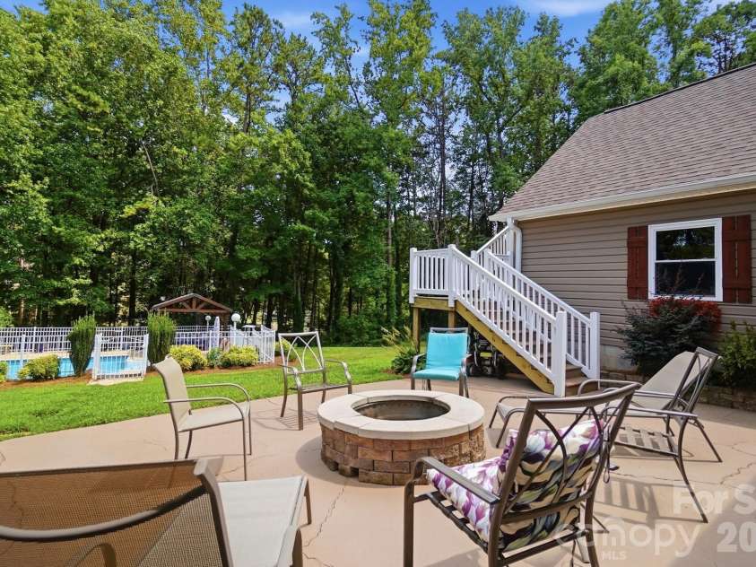 107 Mistywood Drive, Mount Holly, NC 28120.  MLS# CAR4400826, YatesRealty ID 36827. Patio space with fire pit