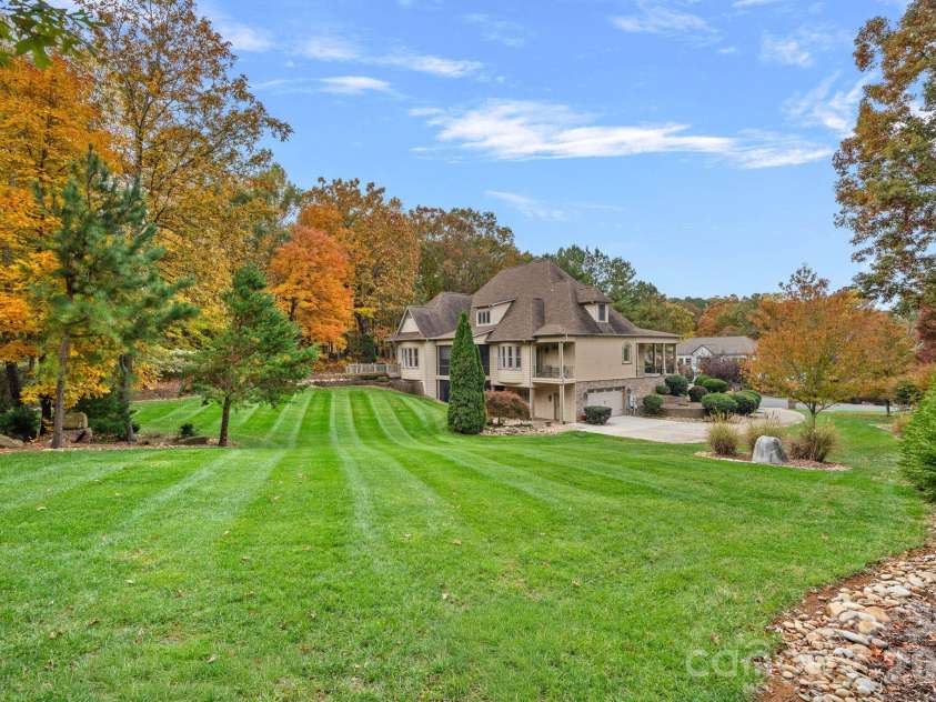 8056 Windsong Road, Denver, NC 28037.  MLS# CAR4338540, YatesRealty ID 3683. Almost 1.4 acres of a beautiful, park-like setting!