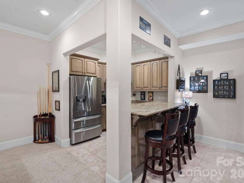 8056 Windsong Road, Denver, NC 28037.  MLS# CAR4338540, YatesRealty ID 3683. Kitchenette/wet bar with counter seating.