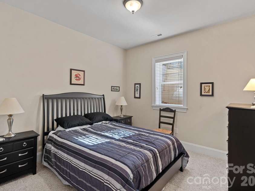 8056 Windsong Road, Denver, NC 28037.  MLS# CAR4338540, YatesRealty ID 3683. Lower level guest bedroom #4 with en-suite bathroom.