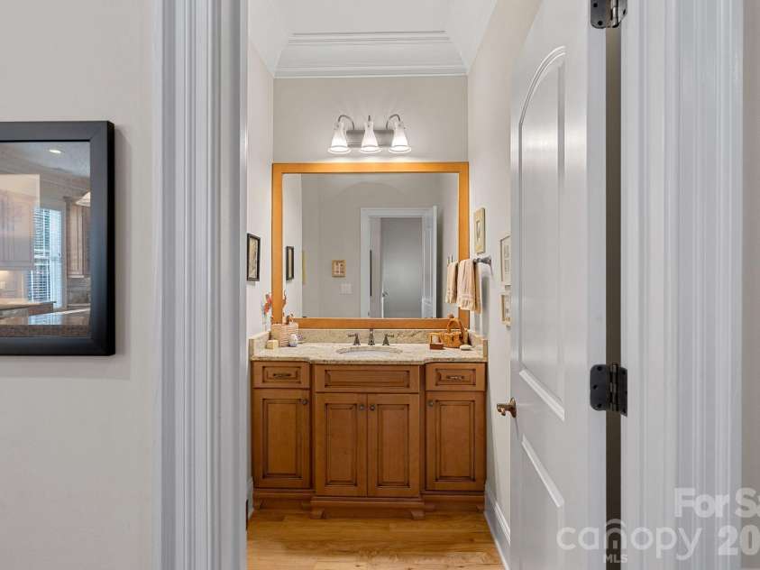 8056 Windsong Road, Denver, NC 28037.  MLS# CAR4338540, YatesRealty ID 3683. Main level half-bathroom between kitchen and dining room.