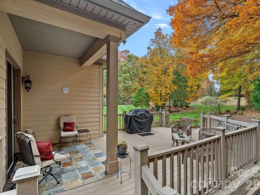 8056 Windsong Road, Denver, NC 28037.  MLS# CAR4338540, YatesRealty ID 3683. Partially covered deck off kitchen - enjoy outdoor meals or entertaining!