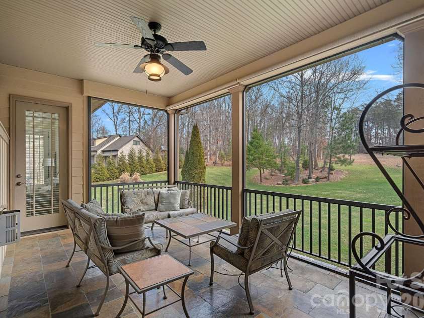 8056 Windsong Road, Denver, NC 28037.  MLS# CAR4338540, YatesRealty ID 3683. Screened porch accessed from the primary bedroom.