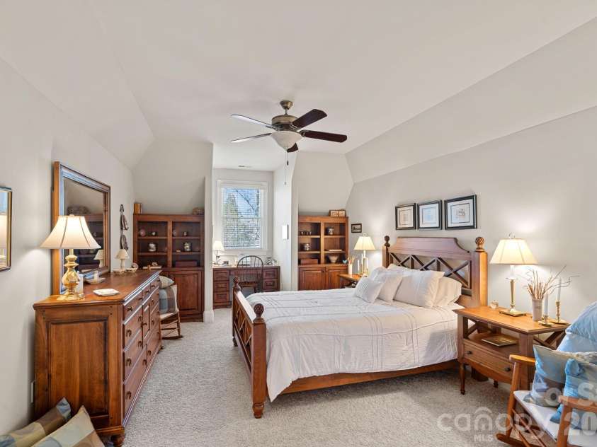 8056 Windsong Road, Denver, NC 28037.  MLS# CAR4338540, YatesRealty ID 3683. Upper guest bedroom #1 with built-ins and en-suite bathroom.