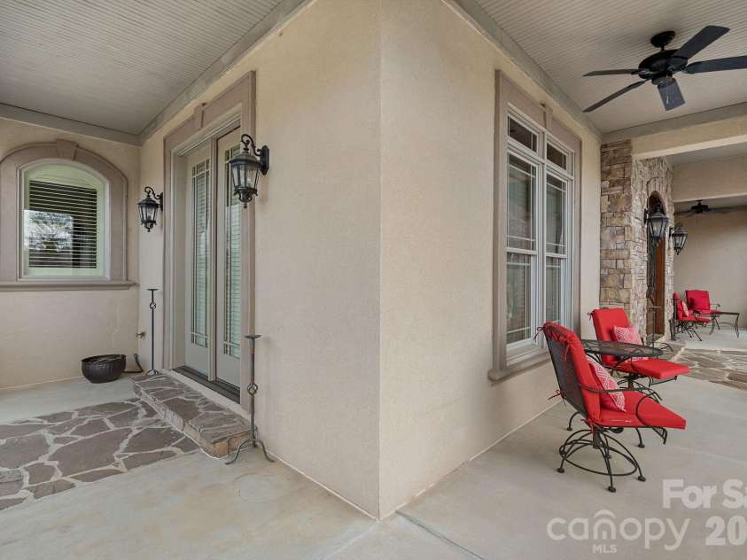 8056 Windsong Road, Denver, NC 28037.  MLS# CAR4338540, YatesRealty ID 3683. Wrap-around front porch with entry to the home through the front door or side door to the den.