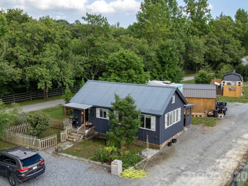 261 & 277 Bent River Farm Road, Pisgah Forest, NC 28768.  MLS# CAR4380957, YatesRealty ID 36835. Blue Tiny House,