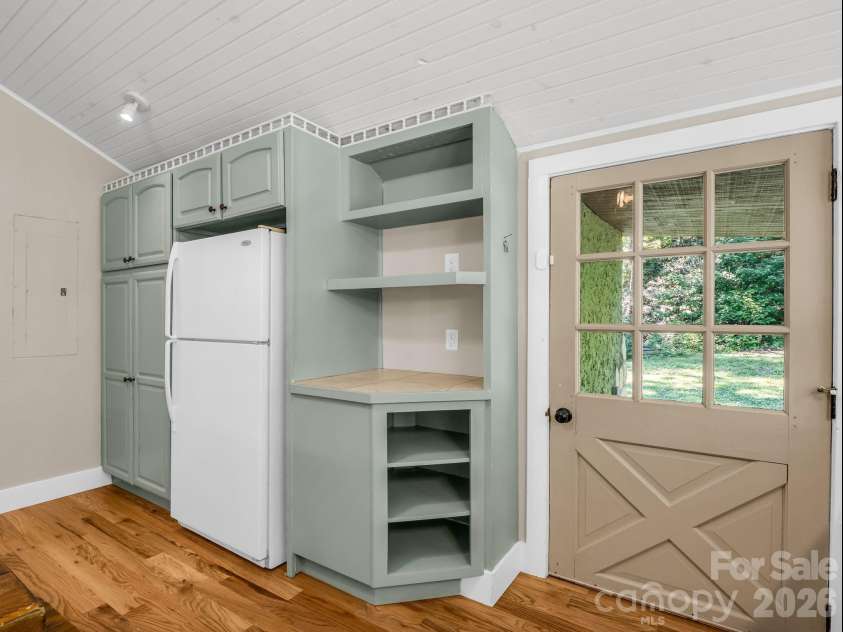 216 Aiken Road, Rosman, NC 28772.  MLS# CAR4401151, YatesRealty ID 36839. Backdoor in kitchen