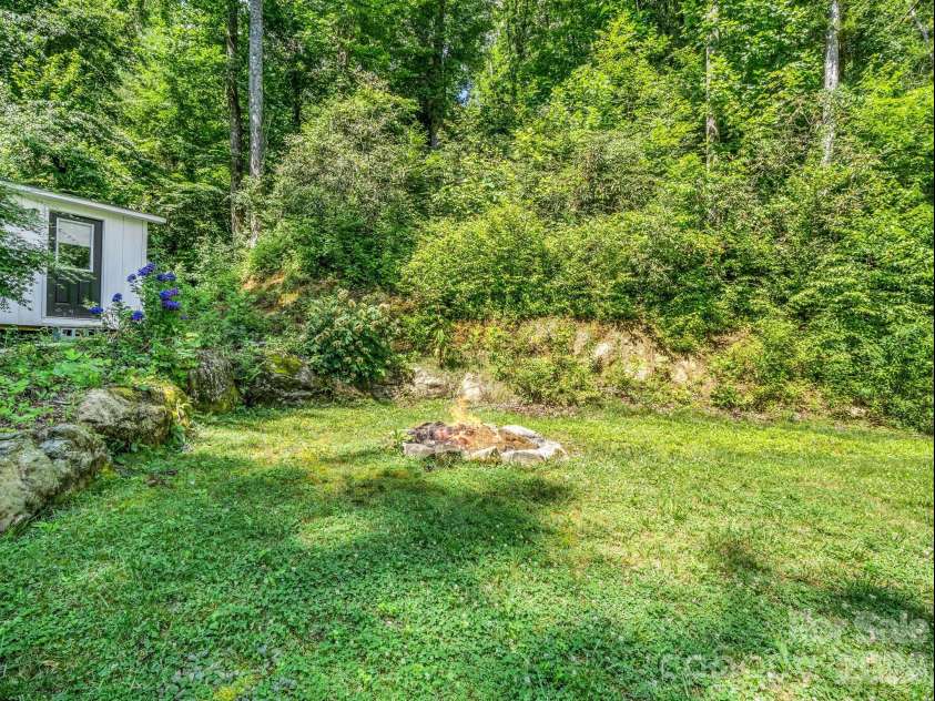 216 Aiken Road, Rosman, NC 28772.  MLS# CAR4401151, YatesRealty ID 36839. Large backyard